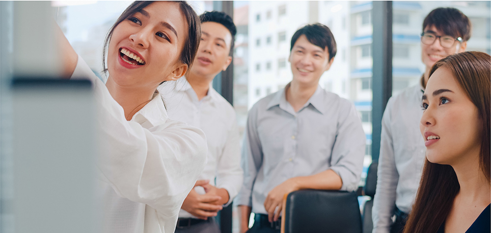 A group of male and female colleagues at a discussion about common remarketing mistakes to avoid 